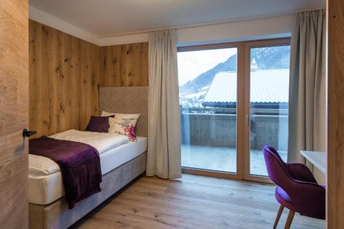 Postel nebo postele na pokoji v ubytování Boutiquehotel die Alpbacherin 4 Sterne Superior
