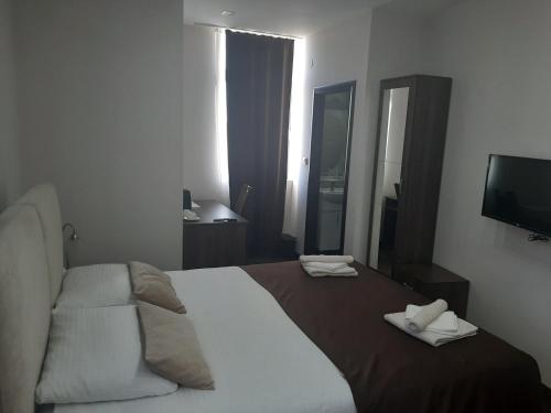 Postel nebo postele na pokoji v ubytování Hotel Usce