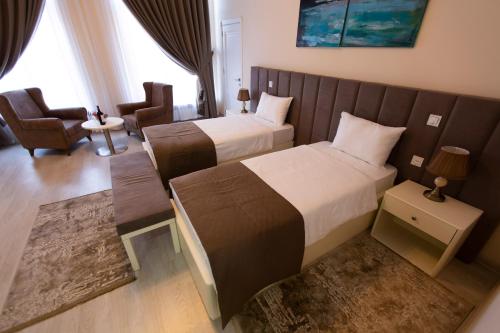 Ένα ή περισσότερα κρεβάτια σε δωμάτιο στο AlmaBagi Hotel&Villas