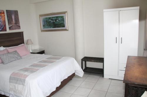 Ένα ή περισσότερα κρεβάτια σε δωμάτιο στο Kayamina Guesthouse