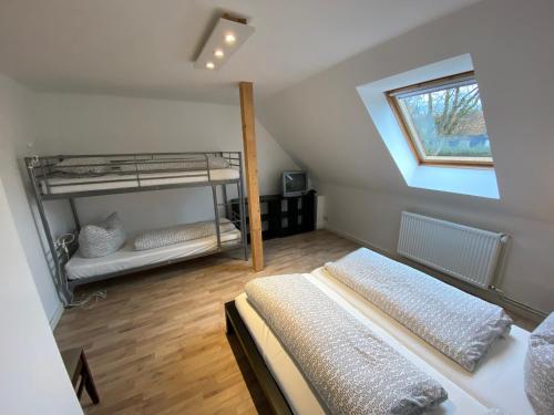 Voodi või voodid majutusasutuse Harzidyll Living Apartements toas