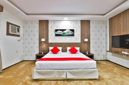 En eller flere senge i et værelse på نجمة نوارة للوحدات الفندقية