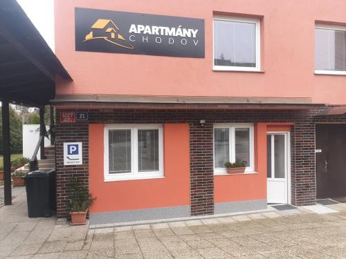 a building with a sign on the side of it at Apartmany Chodov in Prague