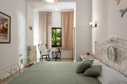 Кровать или кровати в номере Aura Traditional Apartment
