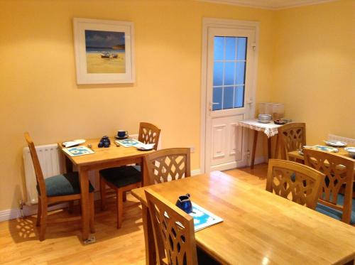a dining room with a table and chairs and a table and chairsktop at Rodini B&B in Kilkenny