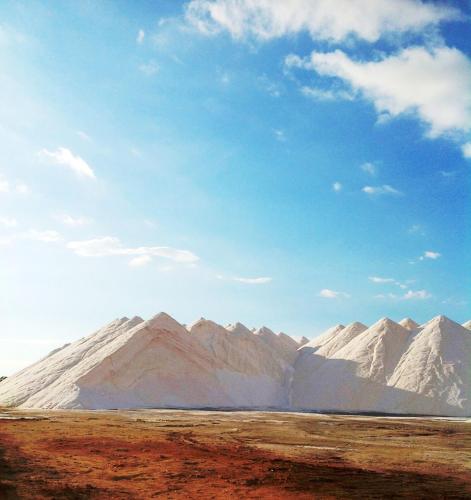 a group of snow covered mountains under a blue sky at Apartamentos Villa Primera in Cala Figuera