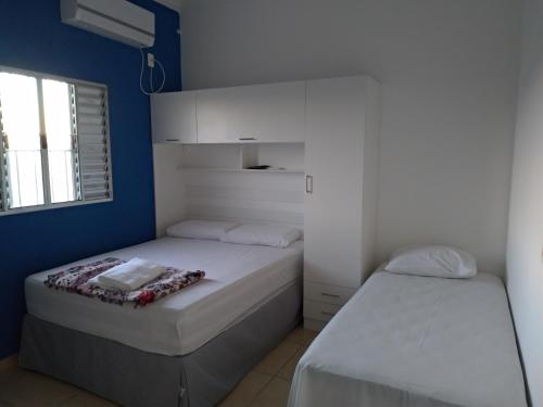 Ένα ή περισσότερα κρεβάτια σε δωμάτιο στο Pousada Lirio dos Vales