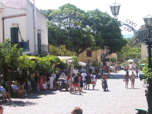 a group of people walking down a street at Residence Timeo in Ustica