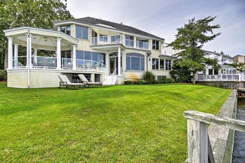 a large house with a large yard at Elegant Riverfront Home with Expansive Views in Point Pleasant