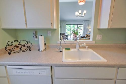 a kitchen counter with a sink and a mirror at Sunny Escape on Golf Course with Patio Near Wineries in Napa