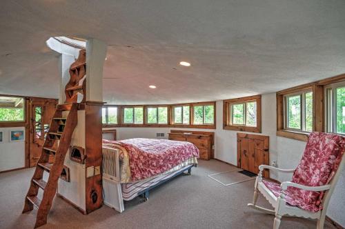 a bedroom with a bunk bed and a ladder at Dragonwood Castle on Waterfront with Stunning View in Prospect Harbor
