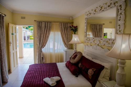 Postel nebo postele na pokoji v ubytování La Barune Guest House