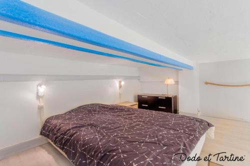 a bedroom with a bed with a blue canopy at Cocooning 1 bedroom with mezzanine - Dodo et Tartine in Toulon