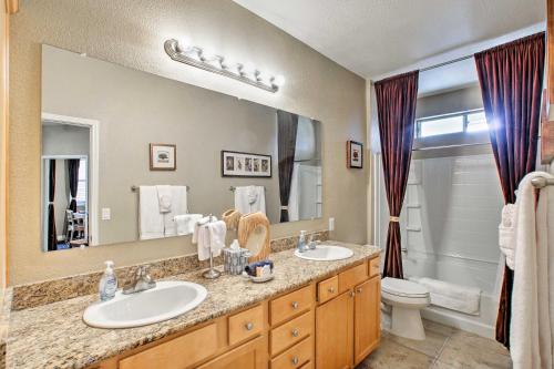 a bathroom with two sinks and a large mirror at Resort Retreat in Paradise Valley and Kierland Area! in Scottsdale