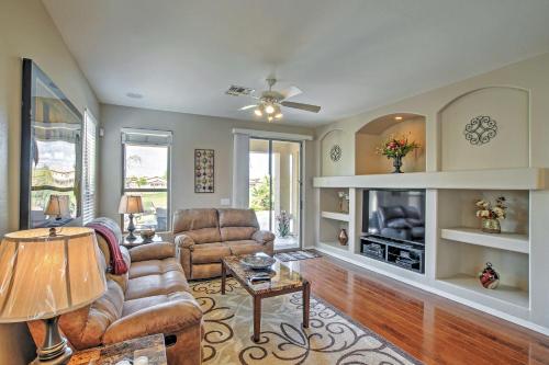 a living room with a couch and a tv at Private Pool and Golf Course View Queen Creek Home in Queen Creek