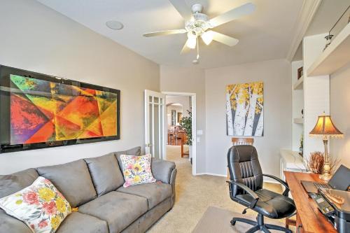 a living room with a couch and a ceiling fan at Private Pool and Golf Course View Queen Creek Home in Queen Creek