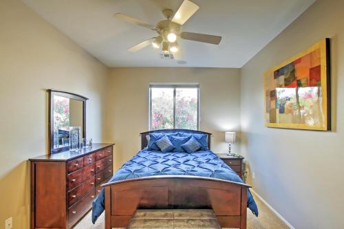 a bedroom with a bed and a ceiling fan at Private Pool and Golf Course View Queen Creek Home in Queen Creek