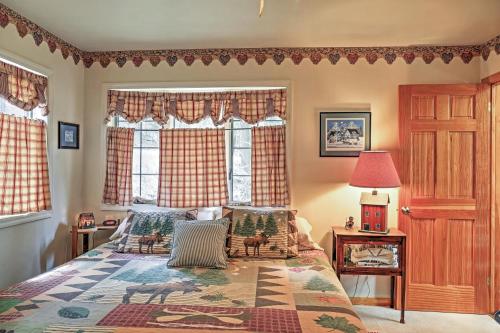a bedroom with a bed and a window at Stamford Lakefront Home with Dock and Wraparound Deck! in Stamford