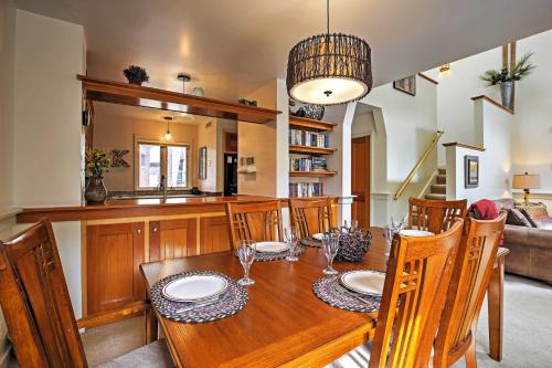 a dining room with a wooden table and chairs at Hot Tub and Grilling Area Keystone Townhome! in Keystone