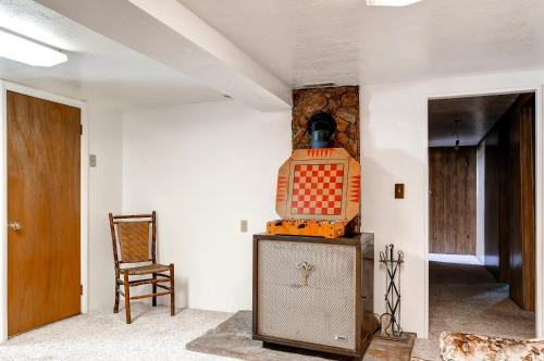 a room with a table and a chair in a room at Charming Tropic Home by a Farm Near Bryce Canyon! in Tropic