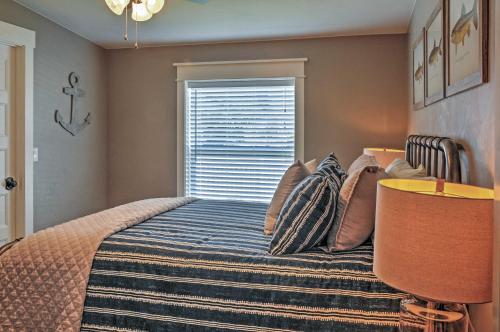 a bedroom with a bed and a window at Rustic Chic Home 10 Mi to Otter Creek State Park! in Circleville