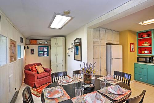 a kitchen and dining room with a table and chairs at Quiet Durango Farmhouse with Beautiful Yard and Gazebo in Durango