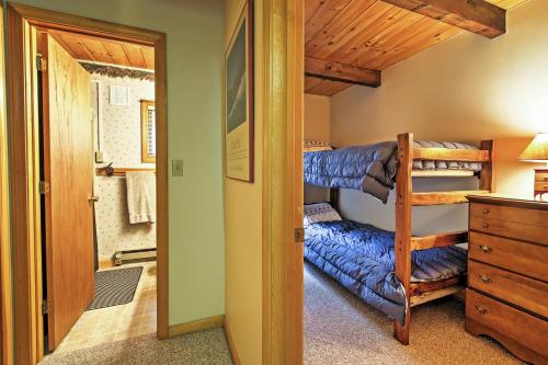 a room with a bunk bed and a bedroom with a desk at Peaceful Lincoln Chalet Less Than 2 Mi to Loon Mtn Skiing! in Lincoln