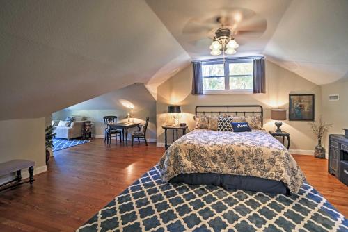 a bedroom with a bed and a ceiling fan at Spacious and Stunning Cleveland Getaway on 1 Acre in Cleveland