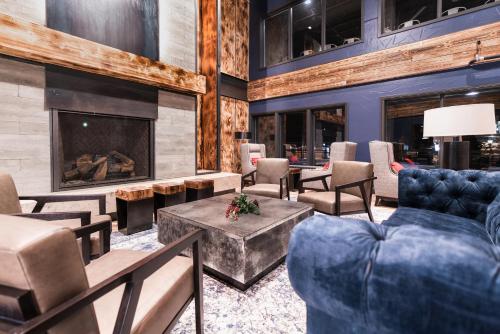 a living room filled with furniture and a fire place at Gravity Haus in Breckenridge