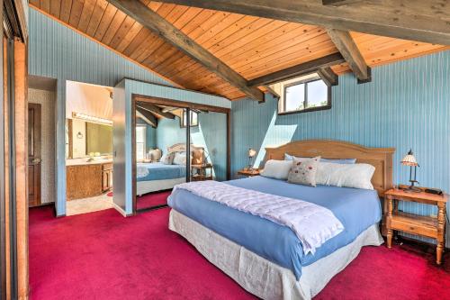 a bedroom with a large bed and a bathroom at Oceanfront Irish Beach Sea Haven Home with Hot Tub in Manchester