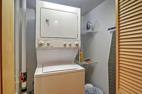 a bathroom with a toilet with a mirror on top of it at Rustic North Conway Cabin Less Than 3 Mi to Cranmore Mtn! in North Conway