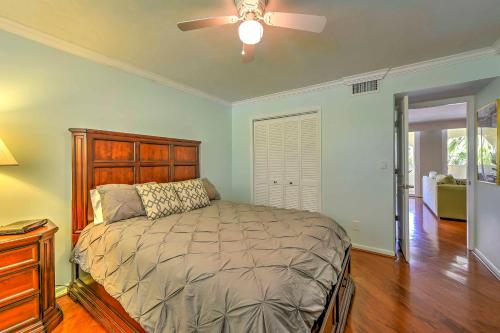 a bedroom with a bed and a ceiling fan at Marco Island Condo with Patio Steps to Beach Access in Marco Island