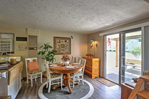 a kitchen and dining room with a table and chairs at Lakeview A-Frame Steps to Marina and Old Field Beach in Lakeview