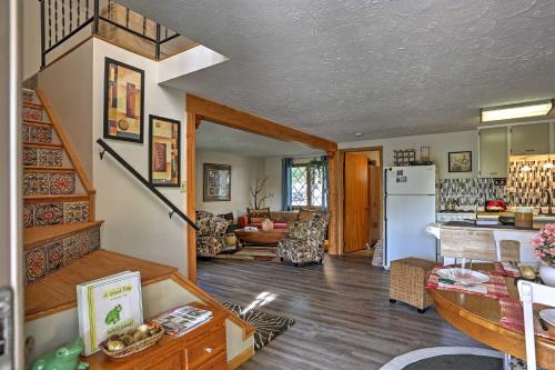 a kitchen and living room with a staircase in a house at Lakeview A-Frame Steps to Marina and Old Field Beach in Lakeview
