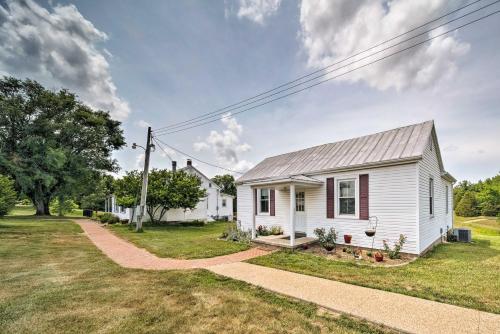 a white house with a gray roof at Cozy Missouri Retreat with Pool, Pond and Fire Pit! in Berger