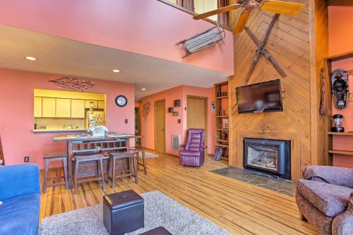 a living room with a fireplace and a tv at All-Season Base in Beech Mountain, Pets Welcome! in Beech Mountain