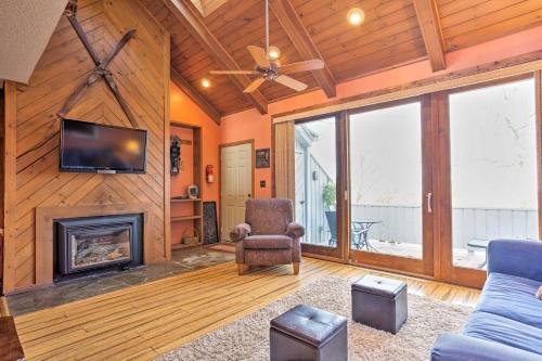 a living room with a fireplace and a tv at All-Season Base in Beech Mountain, Pets Welcome! in Beech Mountain