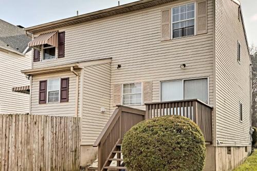 a house with a wooden fence in front of it at Cozy Allentown Home, 2 Mi to Hamilton District! in Allentown
