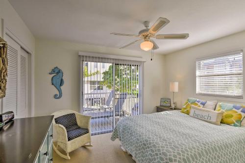 a bedroom with a bed and a ceiling fan at Siesta Keys Home with Deck Half Mile to Turtle Beach in Siesta Key