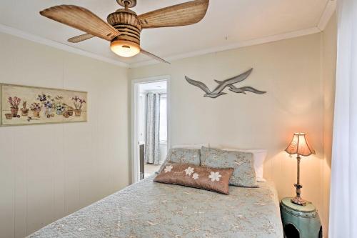 a bedroom with a bed with a ceiling fan at Waterfront Oak Harbor Home on Lake Erie with Views! in Sand Beach