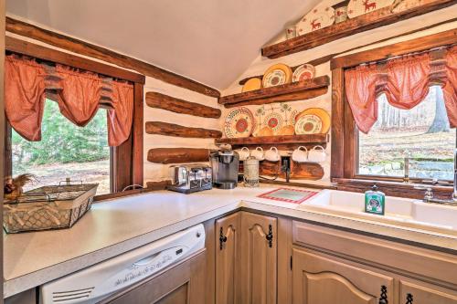 a kitchen with a counter and a sink and a window at Macungie Cabin with Fireplace Near Bear Creek Skiing in Macungie