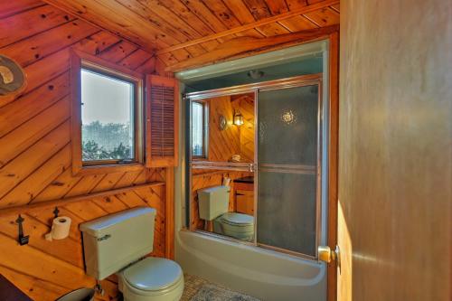 a bathroom with a toilet and a sink and a shower at Biddeford Retreat with Deck, Grill and Ocean Views! in Biddeford