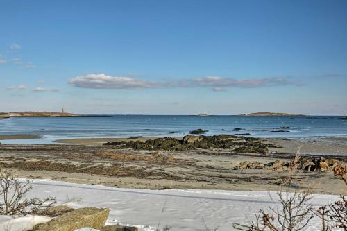 a beach with the ocean in the background at Biddeford Retreat with Deck, Grill and Ocean Views! in Biddeford