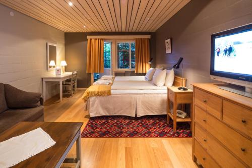 Säng eller sängar i ett rum på Storhogna Högfjällshotell & Spa