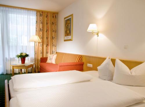 Postel nebo postele na pokoji v ubytování Hotel Auderer
