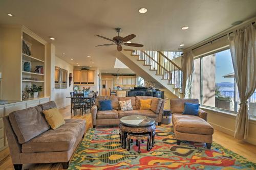 a living room with a couch and a table at Casa dAmore Extravagant Lakefront Villa! in Granite Bay