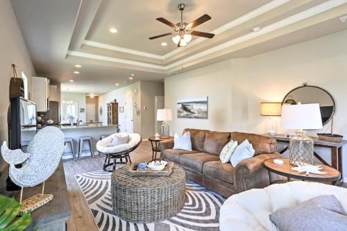 a living room with a couch and a table at Port St Joe Beach House with Pool Access! in Port Saint Joe