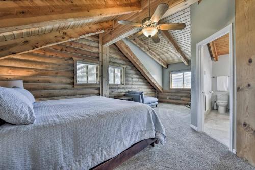 a bedroom with a bed and a ceiling fan at Spacious Hilltop Cabin with Deck and Scenic Views! in Eden