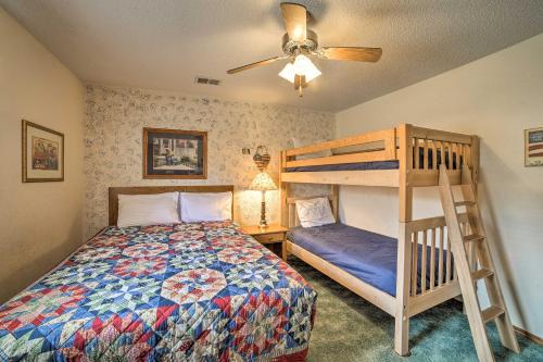 a bedroom with a bunk bed and a ladder at Branson Condo with Views 2 Mi to Silver Dollar City in Branson West