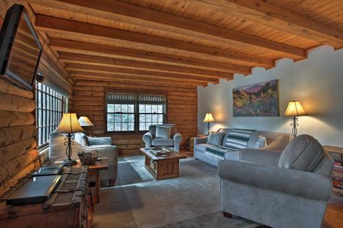 a living room with couches and chairs and a table at Family-Friendly Massanutten Log Home with Views! in McGaheysville